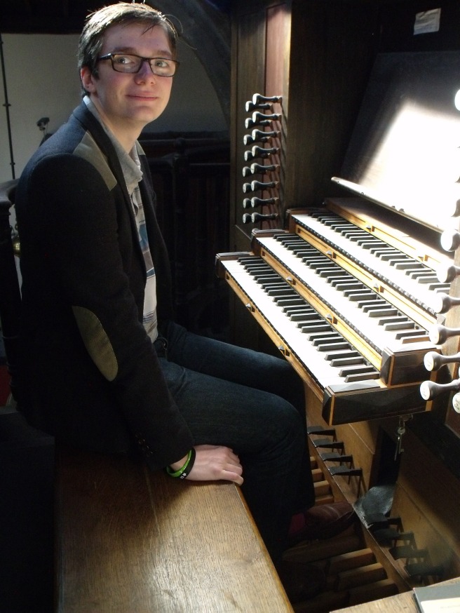 David at the organ console of St Oswald's Parish Church, Durham